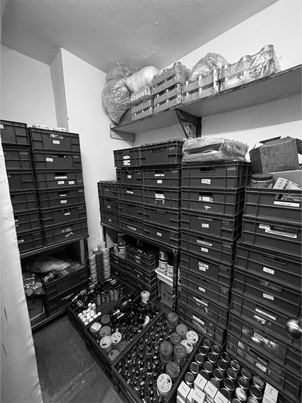 MLSPL stock room — hundreds of SKUs across categories, organized in operating crates.